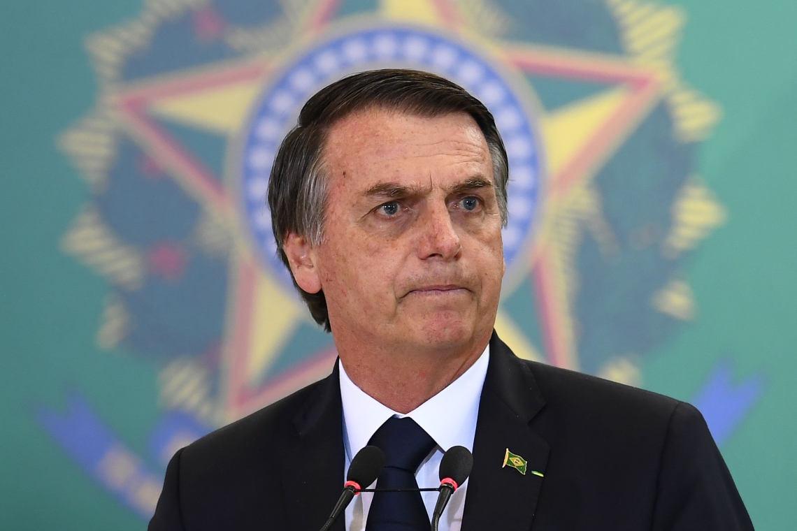 (FILES) In this file photo taken on January 07, 2019 Brazilian President Jair Bolsonaro delivers a speech during the appointment ceremony of the new heads of public banks, at Planalto Palace in Brasilia on January 7, 2019. - US President Donald Trump will host his Brazilian counterpart Jair Bolsonaro on March 19, the White House said March 8, 2019, the first meeting between the two rightwing leaders who have lavished praise on each other. The visit was announced by Brazil's foreign ministry last month but a firm date had not been finalized. (Photo by EVARISTO SA / AFP)