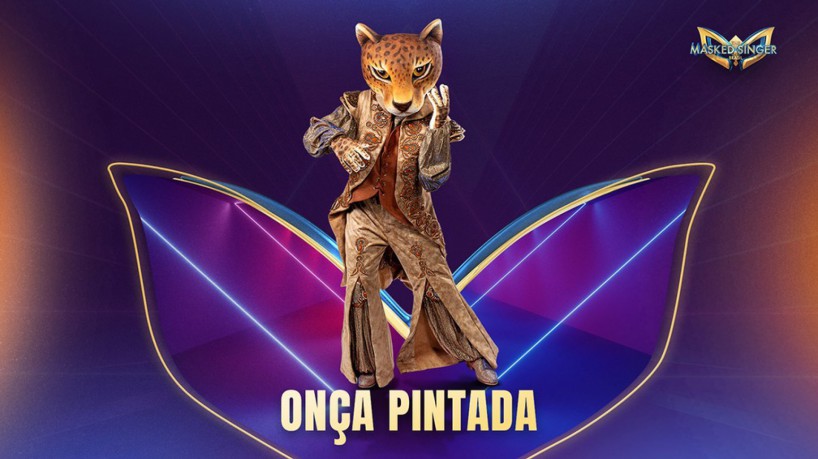 Hoje, 14 de setembro (14/09) jurados tentam descobrir quem é a Onça-Pintada no The Masked Singer Brasil. Vote na nossa enquete e veja os palpites(foto: Reprodução/ TV Globo)