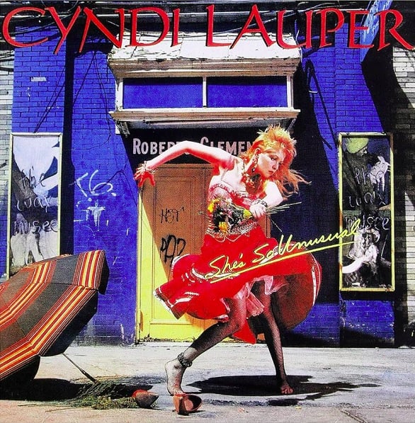 Em 1983, Lauper lançou seu álbum de estreia solo, She's So Unusual, que se tornou um enorme sucesso comercial. 