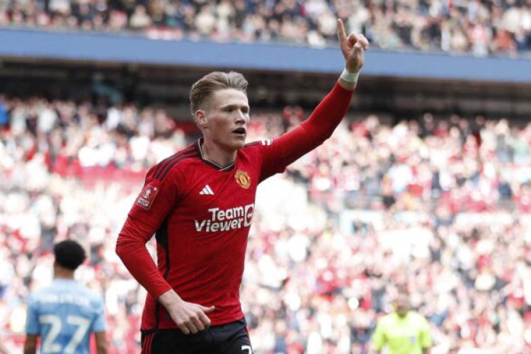 Manchester United's Scottish midfielder #39 Scott McTominay celebrates after scoring the opening goal of the English FA Cup semi-final football match between Coventry City and Manchester United at Wembley Stadium in north west London on April 21, 2024. (Photo by Ian Kington / AFP) / NOT FOR MARKETING OR ADVERTISING USE / RESTRICTED TO EDITORIAL USE (Photo by IAN KINGTON/AFP via Getty Images)