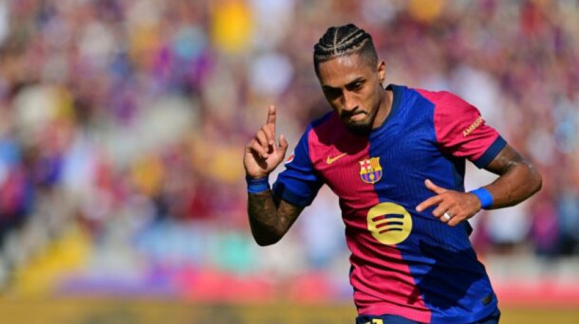 Barcelona's Brazilian forward #11 Raphinha celebrates scoring his team's first goal during the Spanish league football match between FC Barcelona and Real Valladolid FC at the Estadi Olimpic Lluis Companys in Barcelona on August 31, 2024. (Photo by MANU QUINTERO / AFP)