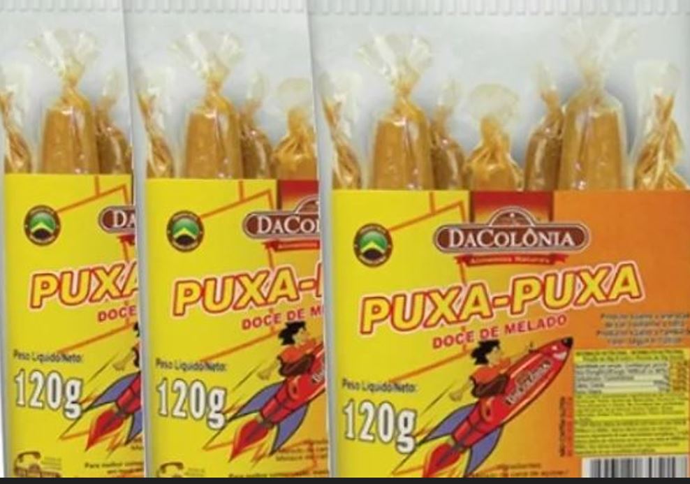 Puxa-puxa - Caramelo feito de melado, açúcar cristal, açúcar invertido e glicose. Ele estica quando é mordido e puxado, divertindo as crianças. 