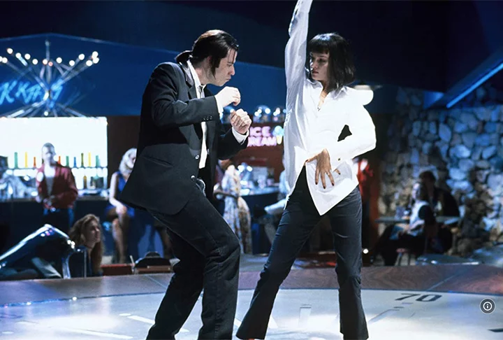 Já na obra de Tarantino (Pulp Fiction), ele vive Vincent Vega, um assassino profissional. Em uma das cenas, curiosamente, ele protagoniza uma icônica cena de dança ao lado de Uma Thurman. 