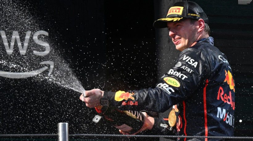 Winner Red Bull Racing's Dutch driver Max Verstappen celebrates on the podium after the 2025 Emilia Romagna Formula One Grand Prix at the Imola autodrome in Imola, on May 18, 2025.