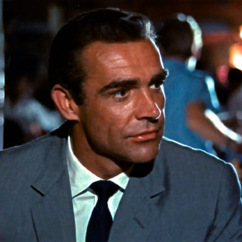 007 é sucesso mundial desde o primeiro filme em 1962, estrelado por Sean Connery. Em  007 Contra o Satânico Dr. No , pela primeira vez o agente fala a clássica frase de apresentação.  Após ganhar um jogo de cartas em um cassino,ele é apresentado para a Bond Girl Sylvia Trench e diz Bond, James Bond. 
