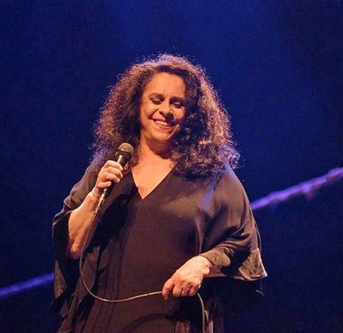 Foi conhecida por sua liberdade criativa e por desafiar padrões de comportamento e estética. Gravou composições de grandes nomes como Tom Zé, Jorge Ben e Dorival Caymmi.Sua voz, considerada uma das mais belas e poderosas do Brasil, permanece viva nas gravações.
