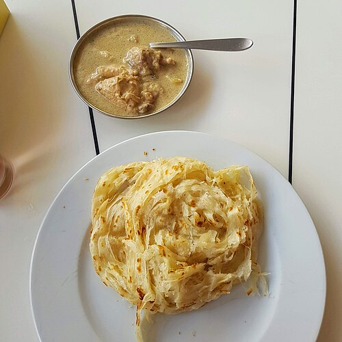 5º lugar – Parotta (Índia). Pão folhado de rua, feito com massa laminada manualmente em várias camadas e frita na chapa, famoso pela textura macia e levemente crocante.