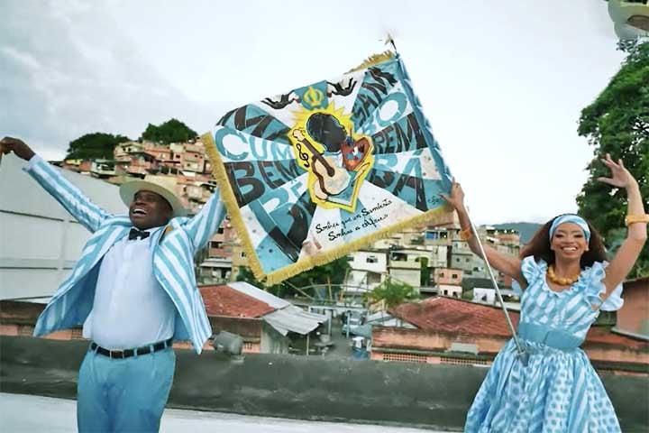 No Carnaval carioca de 2026, a Unidos de Vila Isabel levará para a avenida o enredo “Macumbembê, Samborembá: Sonhei que um Sambista Sonhou a África”.
