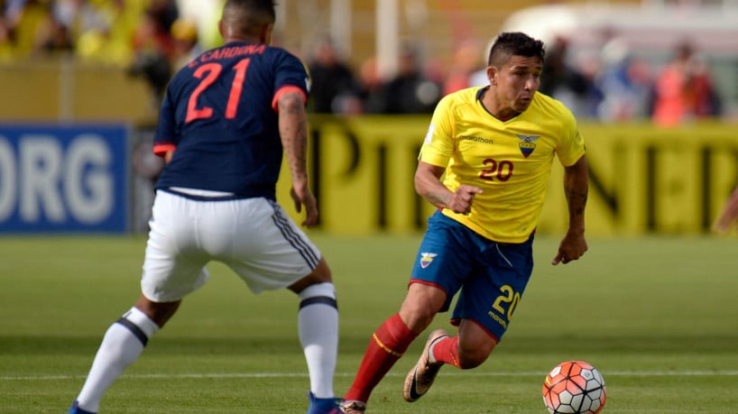 Ecuador's defender Mario Pineida (C) vies for the ball with Colombia's midfielder Edwin Cardona (L) during their 2018 FIFA World Cup qualifier football match in Quito, on March 28, 2017. 