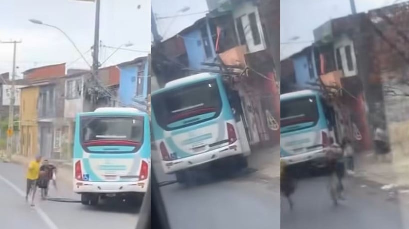 Passageiros fogem pela janela do ônibus, após fumaça sair da fiação elétrica do poste em que o veículo colidiu 