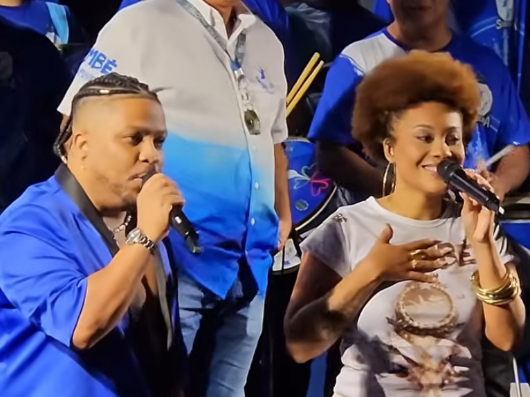 Nino do Milênio e Jessica Martin – Dupla escolhida na final do reality ‘A Voz do Carnaval’ para substituir Neguinho, ícone absoluto da Beija-Flor e que se aposentou. Com estilos complementares, eles têm a missão de serem os intérpretes de “Bembé do Mercado”.
