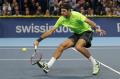 Argentinian Juan Martin Del Potro returns the ball to Swiss Roger Federer on October 28, 2012 during the final match of the Swiss Indoors ATP tennis tournament in Basel. AFP PHOTO / FABRICE COFFRINI
