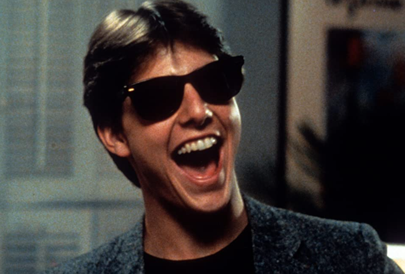 O ator estreou no cinema em 1983, aos 21 anos, no filme Risky Business (foto), três anos antes de alcançar o sucesso em Top Gun. 